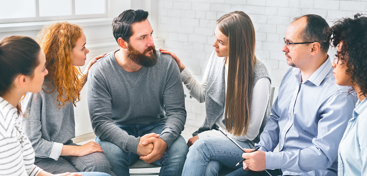 Family members sitting in support group