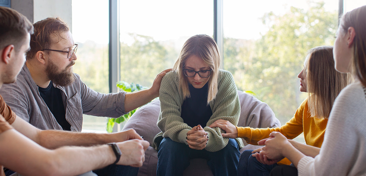 Support group members sitting in circle