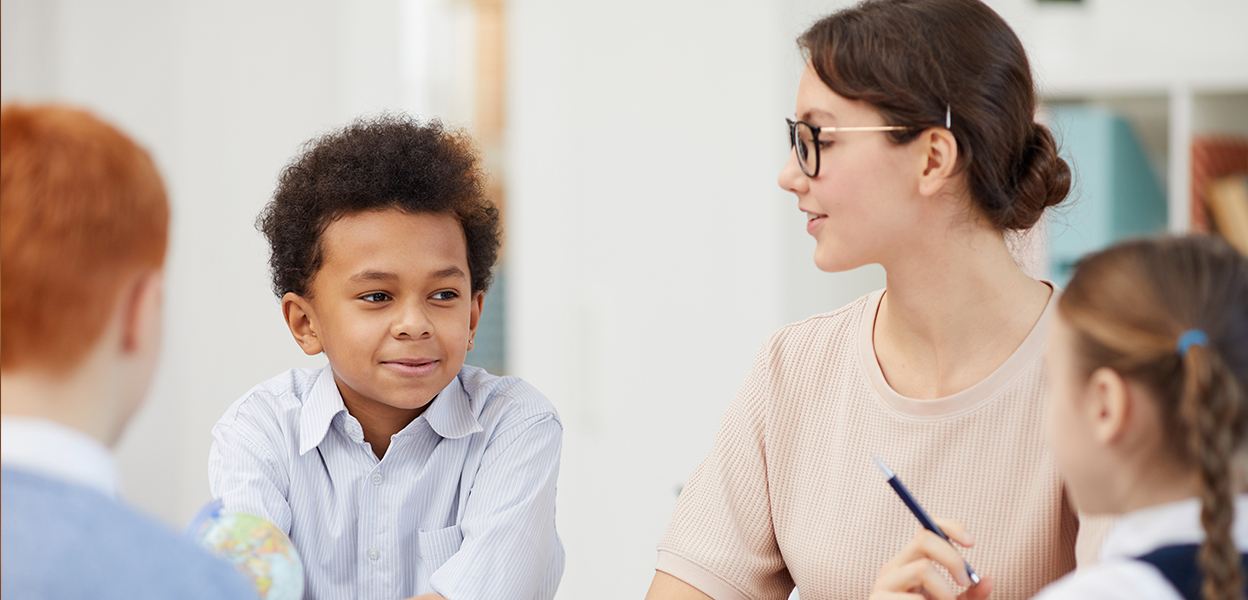 Student speaking with school counselor privately