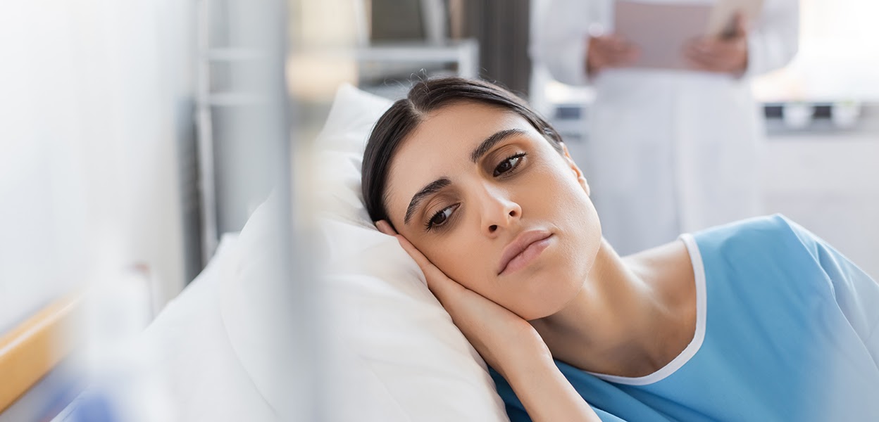 Person sitting alone in hospital waiting room