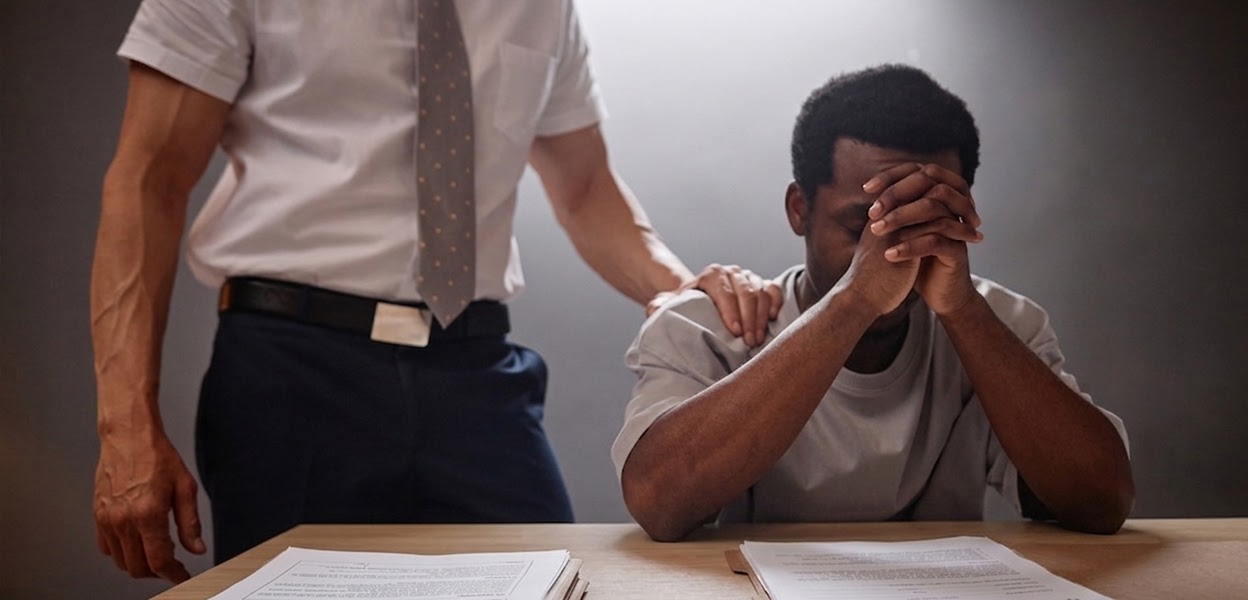 Person reviewing legal documents with concern