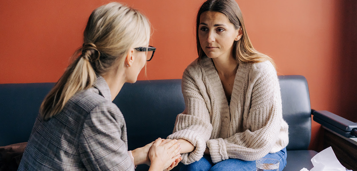Person speaking with a compassionate counselor